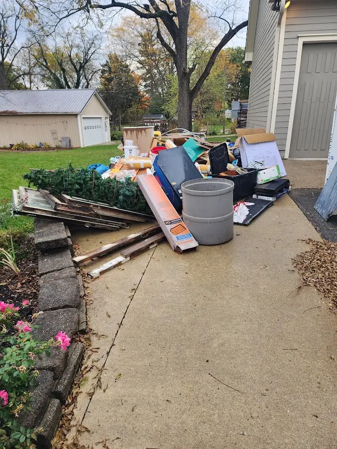Dumpster being loaded with debris for 30 Yard Dumpster Rental in Buckhorn